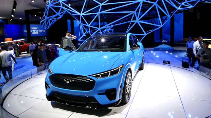 People visit Ford's all-electric SUV Mustang Mach-E at the 2019 Los Angeles Auto Show in Los Angeles, the United States, Nov. 22, 2019.