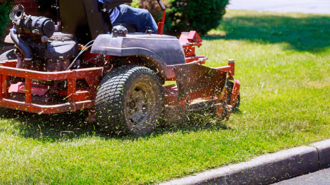 GP: process of lawn mowing, concept of mowing the lawn, lawnmower cutting grass with gardening tools