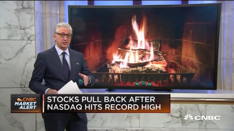Stocks pull back on Christmas Eve after Nasdaq hits record high