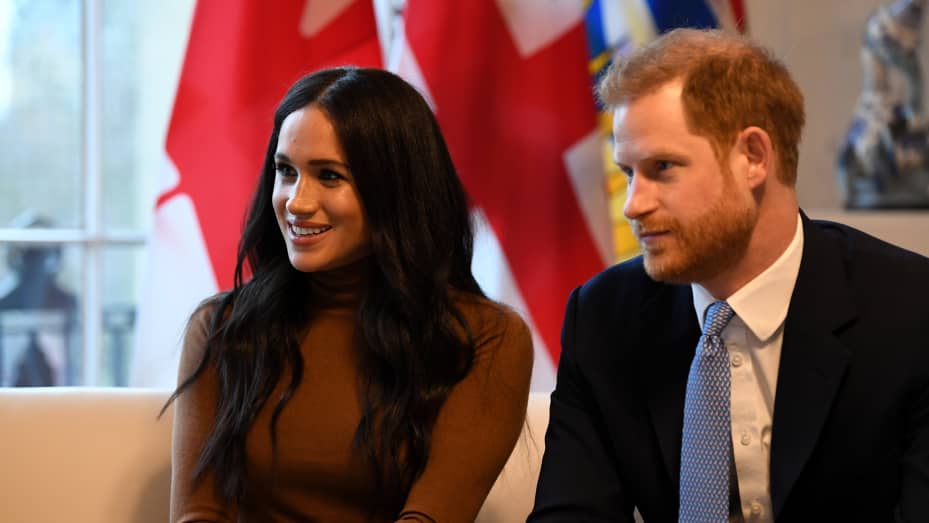 Prince Harry, Duke of Sussex and Meghan, Duchess of Sussex gesture during their visit to Canada House in thanks for the warm Canadian hospitality and support they received during their recent stay in Canada, on January 7, 2020 in London, England. (Photo by DANIEL LEAL-OLIVAS - WPA Pool/Getty Images)