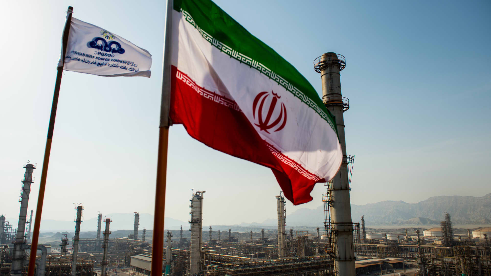 An Iranian national flag flies above the new Phase 3 facility at the Persian Gulf Star Co. (PGSPC) gas condensate refinery in Bandar Abbas, Iran, on Wednesday, Jan. 9. 2019. The third phase of the refinery begins operations next week and will add 12-15 million liters a day of gasoline output capacity to the plant, Deputy Oil Minister Alireza Sadeghabadi told reporters.