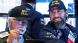 Trader Peter Tuchman and specialist trader Michael Pistillo wear DOW 29,000 hats on the floor at the New York Stock Exchange (NYSE) in New York, January 15, 2020.