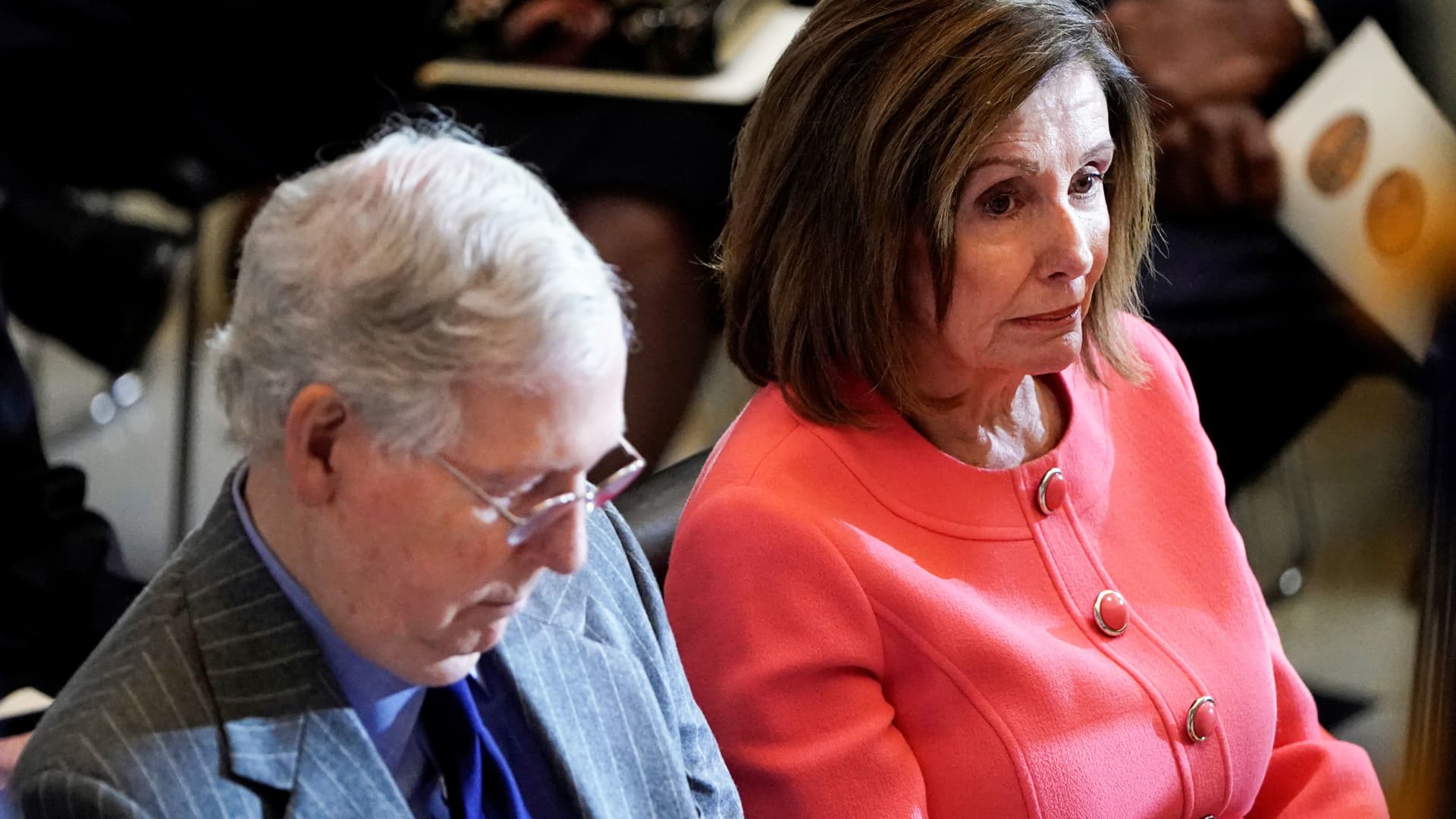 House Speaker Nancy Pelosi (D-CA) and Senate Majority Leader Mitch McConnell (R-KY) sit next to each other during a Congressional Gold Medal Award ceremony for Steve Gleason at the U.S. Capitol in Washington, January 15, 2020.