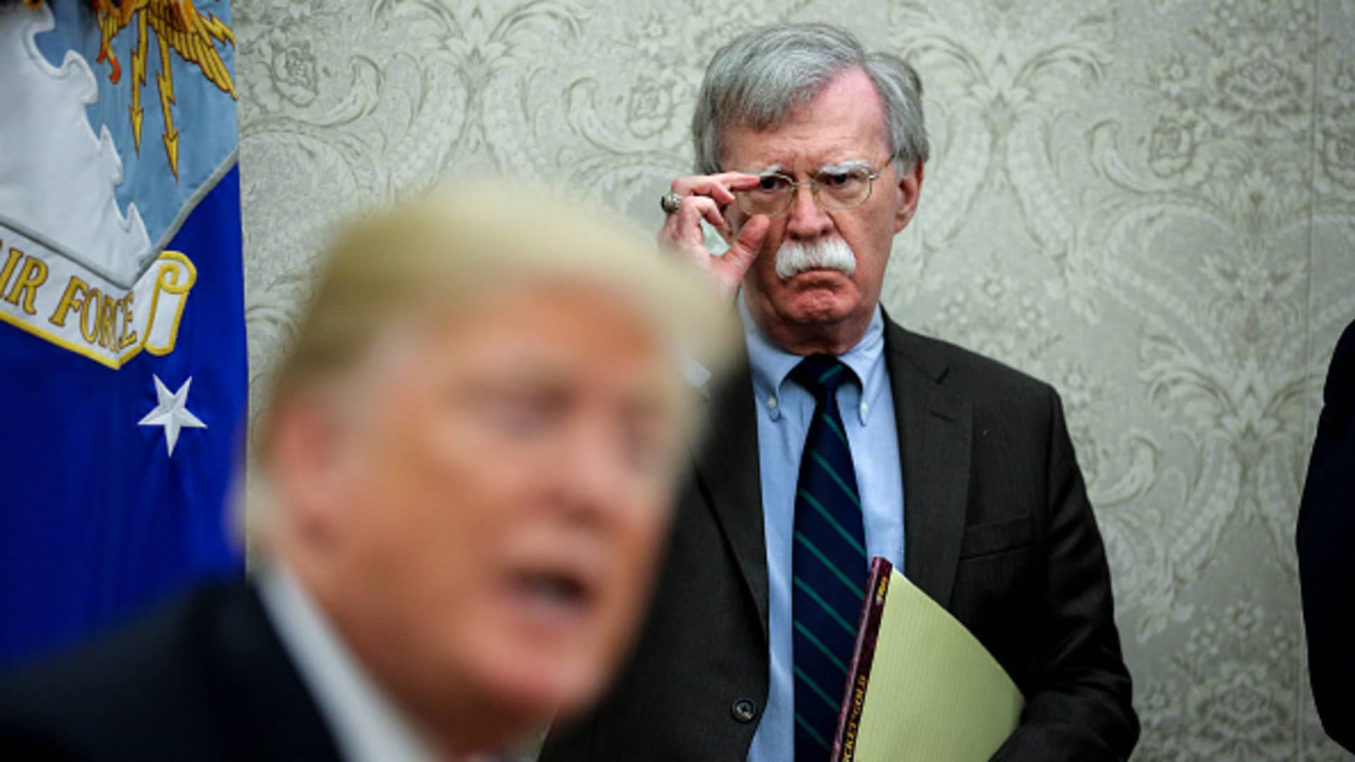 National security advisor, John Bolton, right, attends a meeting with President Donald Trump and President of Chile, Sebastian Piñera in the Oval Office of the White House on September 28, 2018 in Washington, DC.