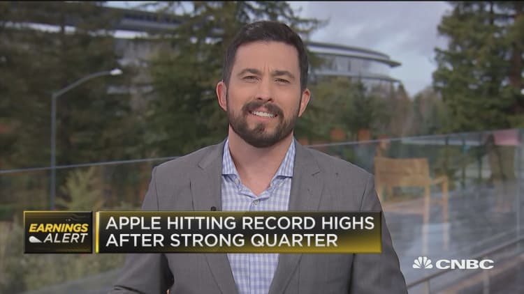 Apple jumps on earnings