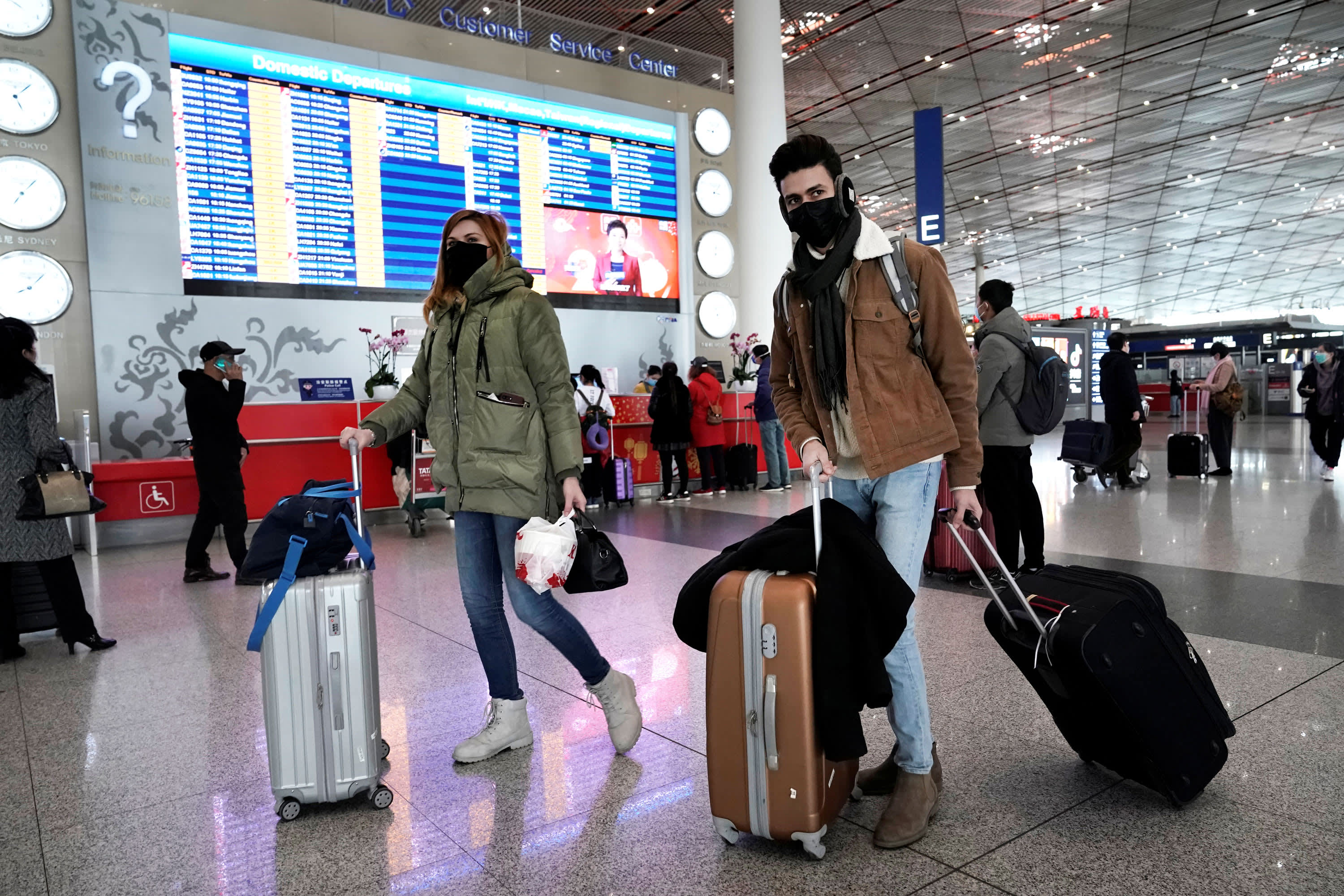 Travelers to China encounter changing coronavirus quarantine policies