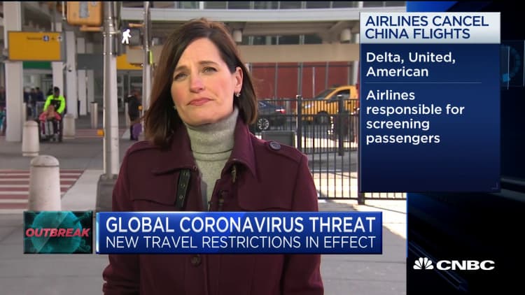 New US travel restrictions take effect to fend off coronavirus outbreak