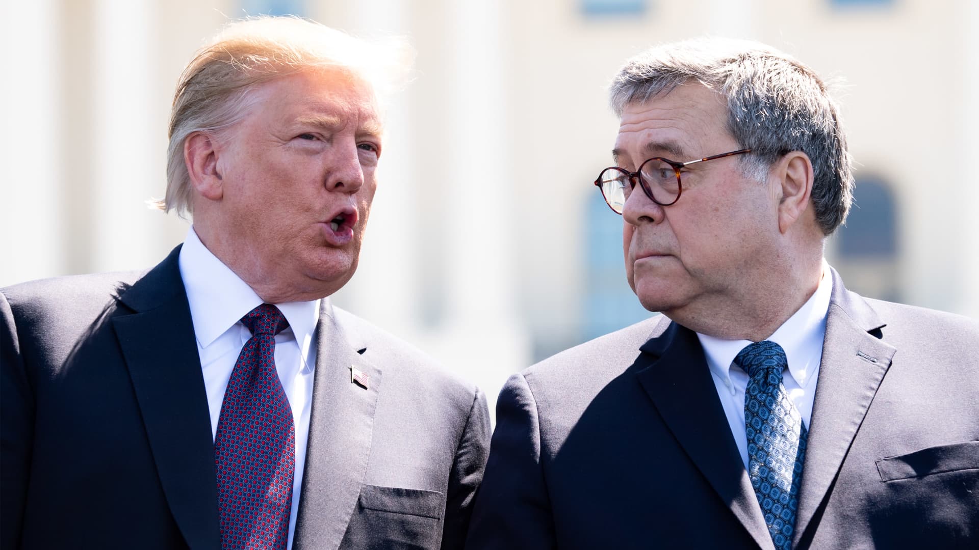 U.S. President Donald Trump, left, speaks to William Barr, U.S. attorney general, during the 38th annual National Peace Officers Memorial Day service at the U.S. Capitol in Washington, D.C., May 15, 2019.