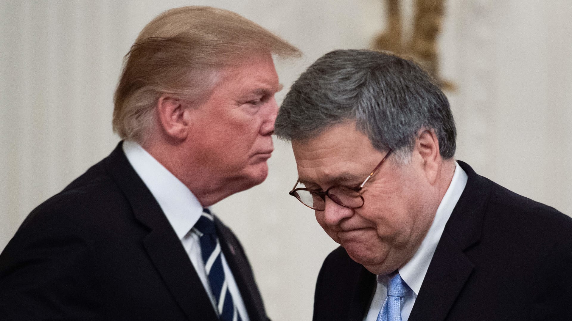 US President Donald Trump (L) shakes hands with US Attorney General William Barr (R) during the Public Safety Officer Medal of Valor presentation ceremony at the White House in Washington, DC on May 22, 2019.