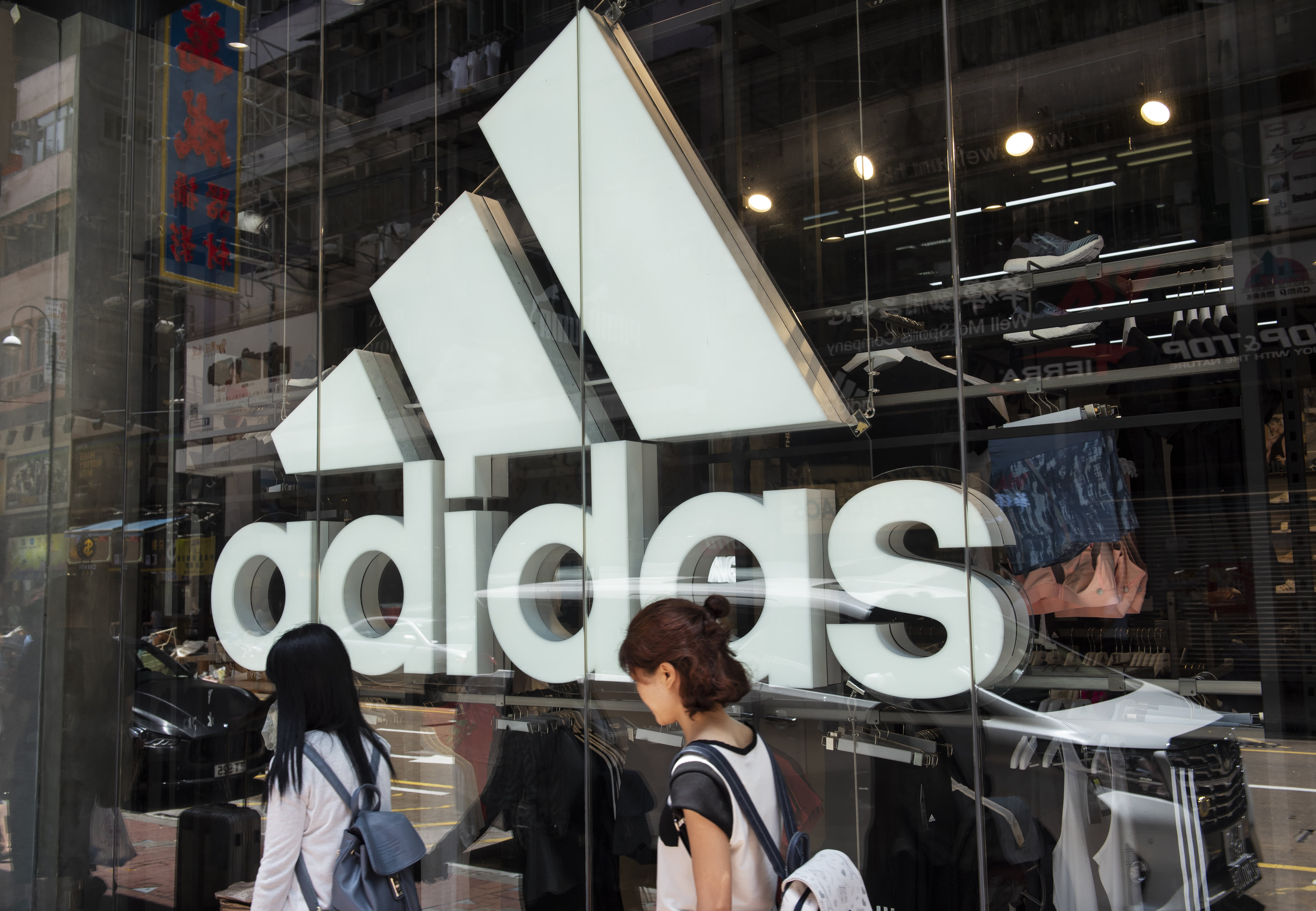 Adidas raises outlook despite falling sales in China as boycott there continues