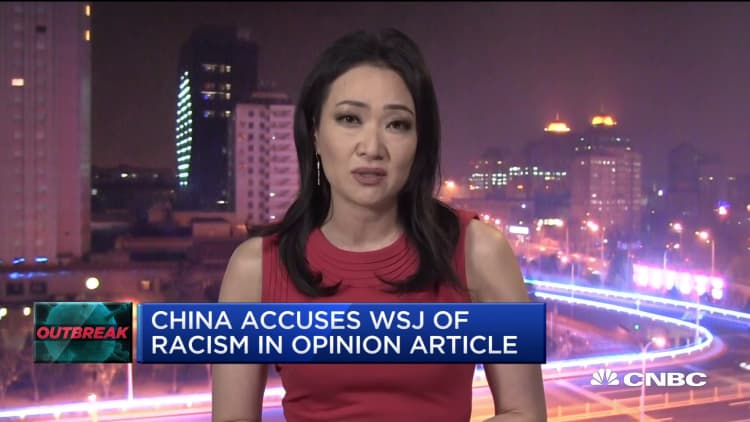 China accuses Wall Street Journal of racism, deports three reporters