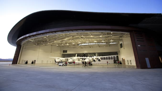 Virgin Galactic's spacecraft Unity and carrier aircraft Eve in the hangar at Spaceport America in New Mexico.