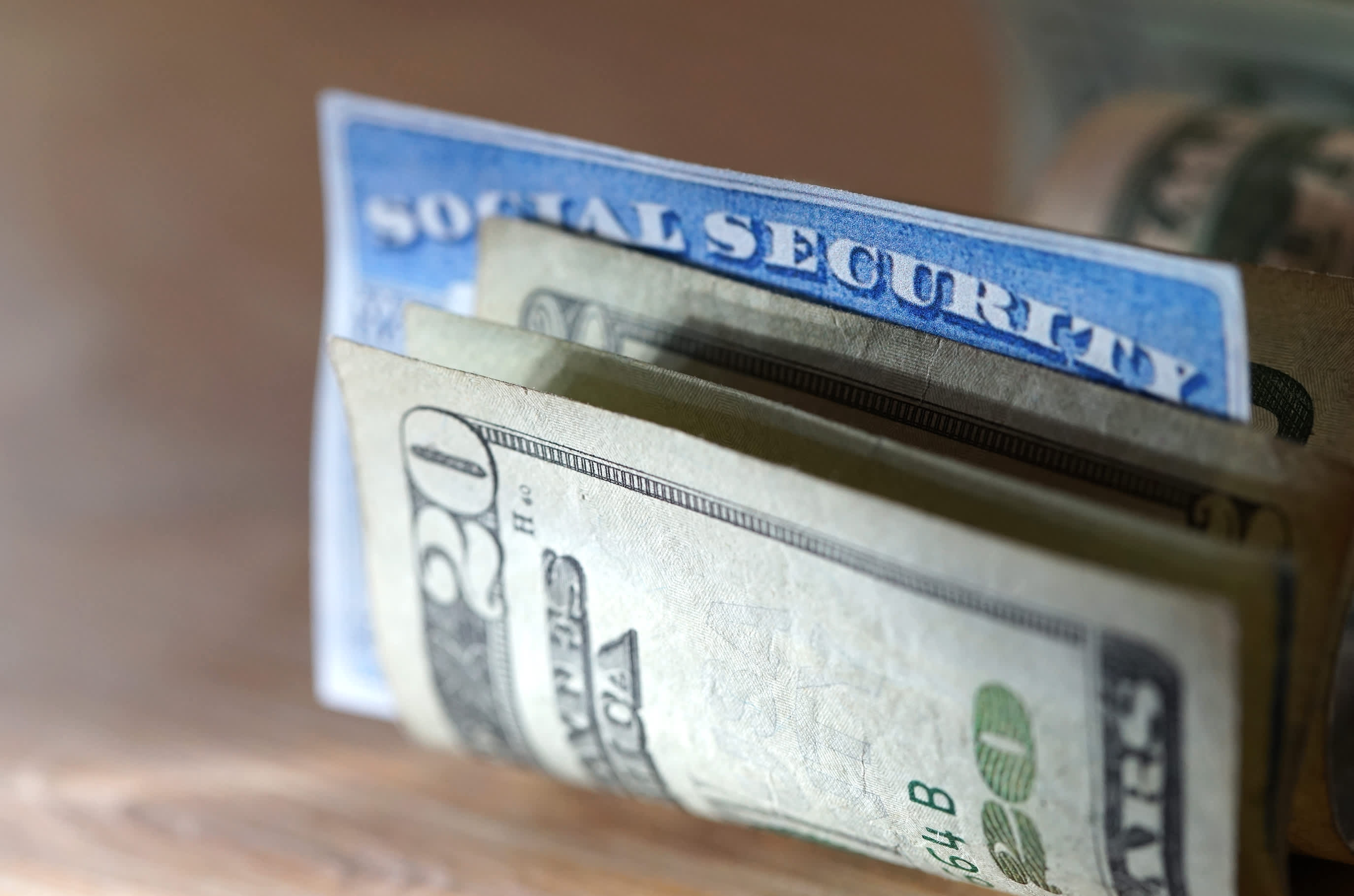 Here's how much your benefits could drop if Social Security trusts run out of mo..