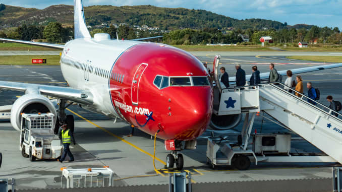 Norwegian Air Shuttle Boeing 737-800 aircraft with registration LN-DYE as seen with passengers boarding on the airplane for departure at Ålesund Airport, Vigra AES ENAL in Møre og Romsdal county, Norway.
