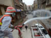Pakistani rescue workers spray disinfectants in an effort to curb the spread of corona virus outbreak in Peshawar, Pakistan.