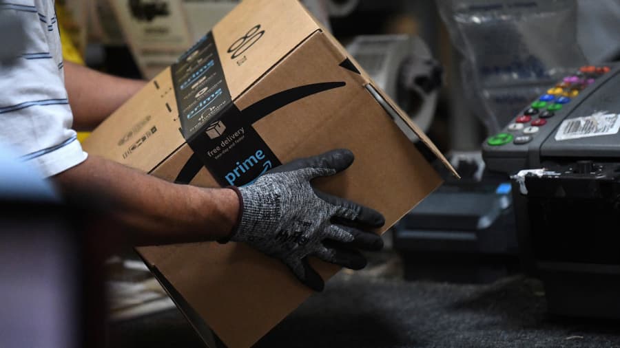 A worker assembles a box for delivery at the Amazon fulfillment center in Baltimore, Maryland, U.S., April 30, 2019.