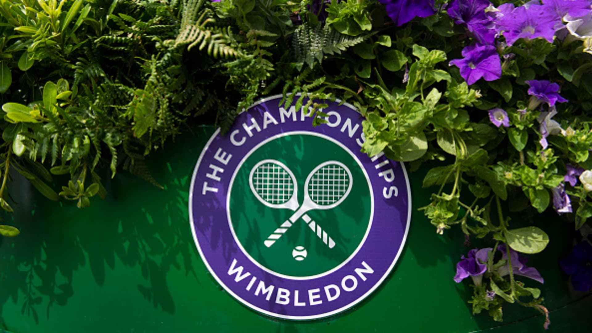 The Wimbledon logo amongst flowers The Championships at All England Lawn Tennis and Croquet Club on July 10, 2019 in London, England.