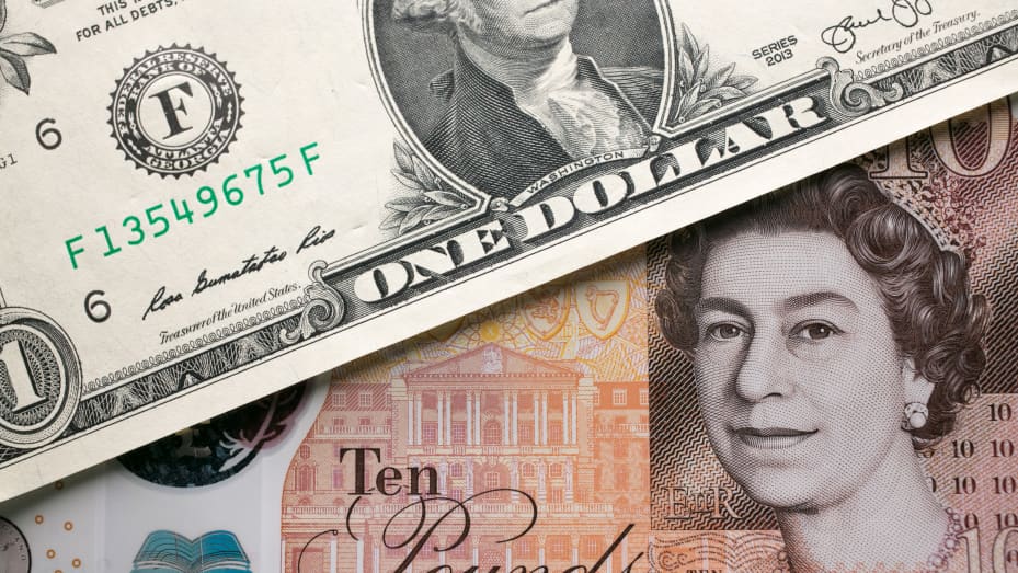 A £10 note is seen alongside a US dollar bill.