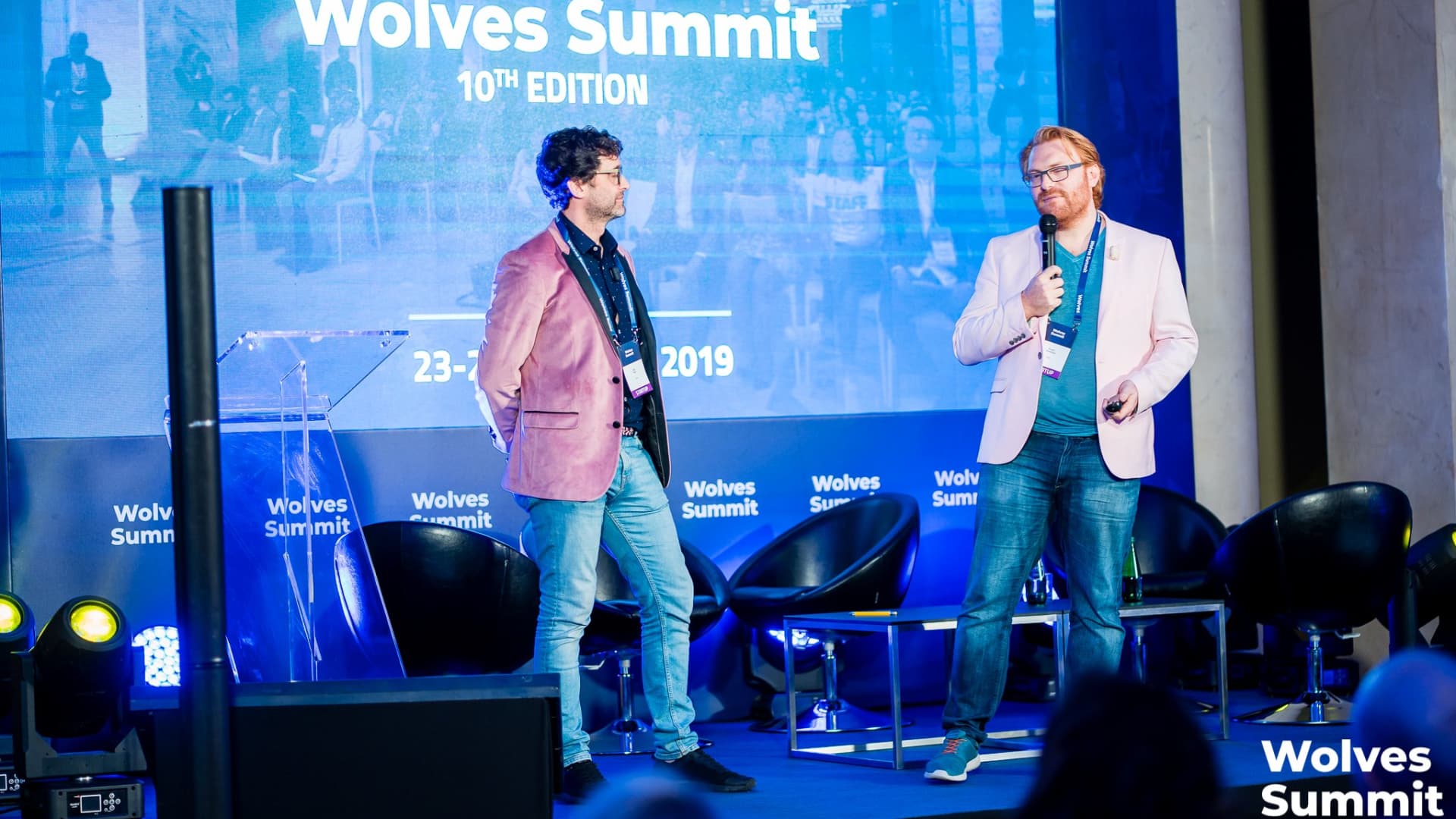 Pynk co-founders Seth Ward and Rupert Barksfield on the stage of the 10th Wolves Summit, winning their startup pitch competition.