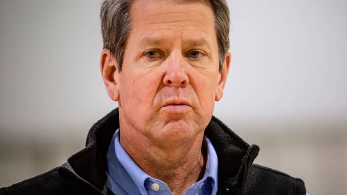 Georgia Gov. Brian Kemp listens to a question from the press during a tour of a massive temporary hospital at the Georgia World Congress Center on Thursday, April 16, 2020, in Atlanta.