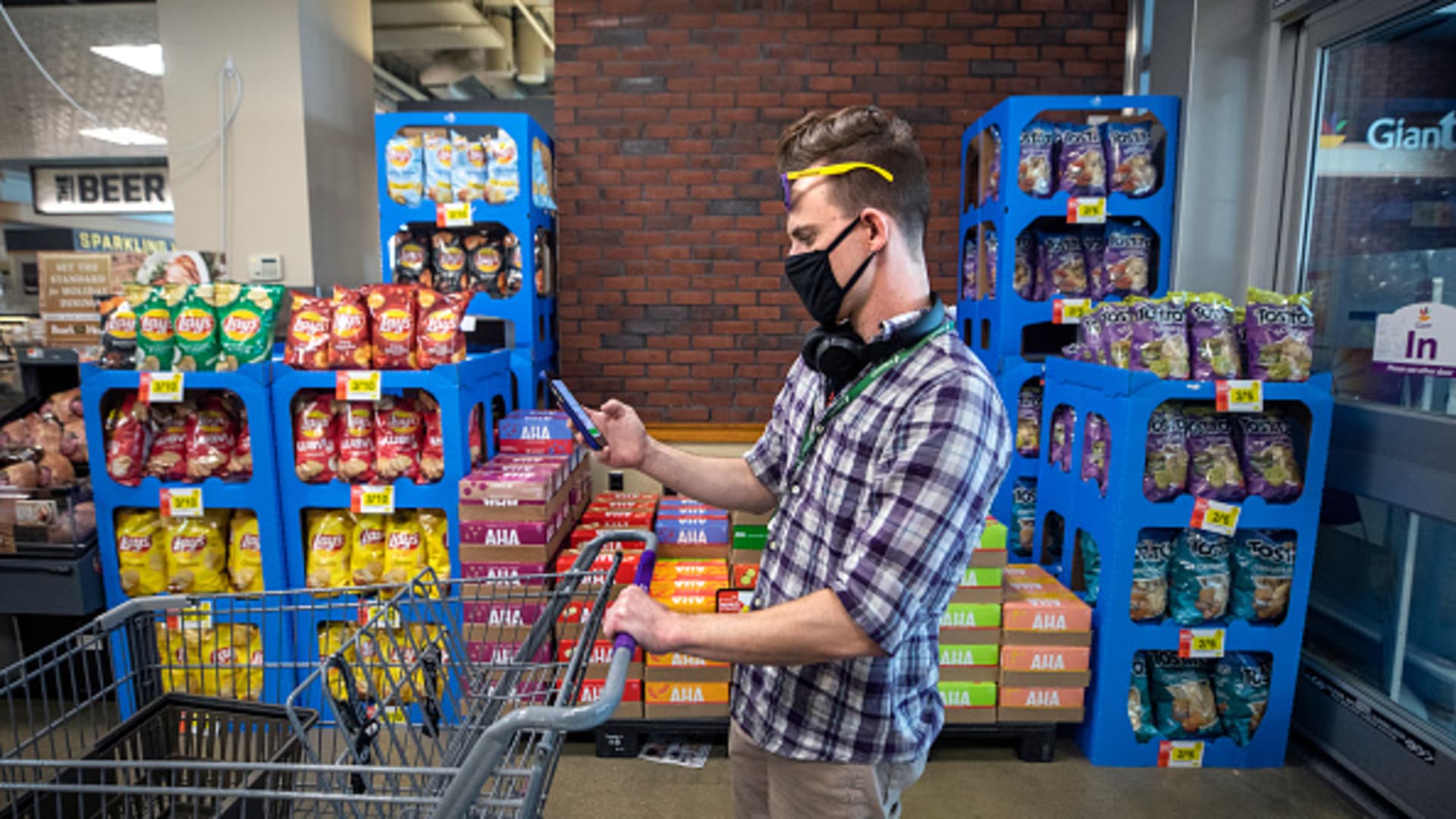 A shopper prepares fill his cart at a Giant supermarket in Washington, DC, April 6, 2020.