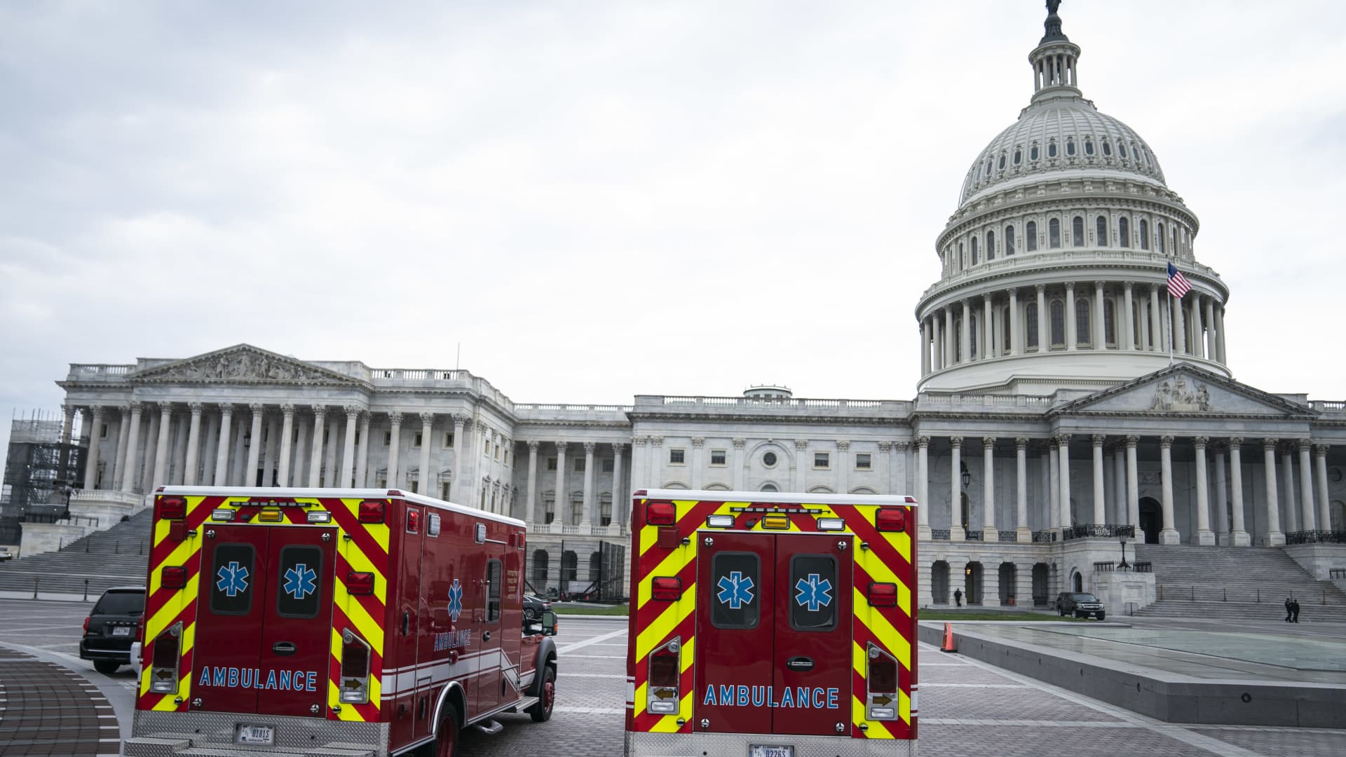 Ambulances sit parked outside of U.S. Capitol in Washington, D.C., U.S., on Tuesday, April 21, 2020. The Senate has scheduled a late afternoon session Tuesday in anticipation of approving an agreement on a nearly $500 billion stimulus bill, including $310 billion to replenish the small business program.