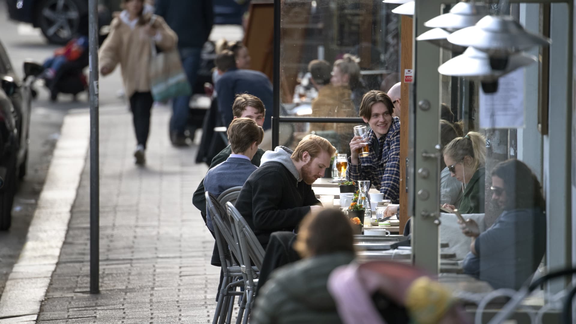 People enjoy themselves at an outdoor restaruant, amid the coronavirus disease (COVID-19) outbreak, in central Stockholm, Sweden, on April 20, 2020.