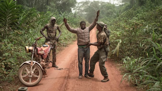 The rangers of the dog squad search a motorcycle taxi for pangolin scales or hunting ammunition in the Dzanga-Sangha Park, in Bayanga, on March 14, 2020. The 4 species of African pangolins are present in the Central African Republic and protected by law s
