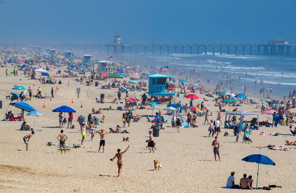 Coronavirus live updates: California to close beaches after crowds; quarterly earnings results reveal pressure - CNBC