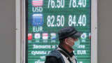 A board displaying currency exchange rates.