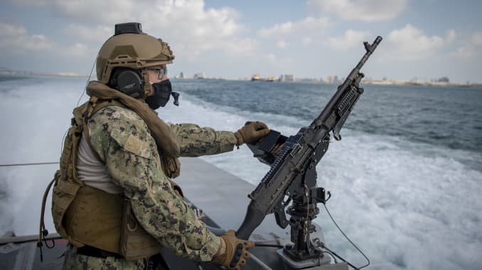 Electronics Technician 2nd Class Hao Lienh, assigned to Commander Task Force 56, stands watch on a Mark VI patrol boat before a weapons sustainment exercise in the Arabian Gulf, April 16, 2020.