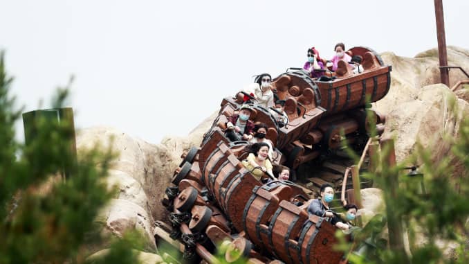 Riders wearing face masks are seen on the Seven Dwarfs Mine Train at Shanghai Disney Resort after the coronavirus pandemic on May 11, 2020 in Shanghai, China.