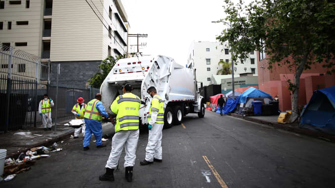 Sanitation workers clean and disinfect the streets of Skidrow during the coronavirus pandemic on April 20, 2020 in Los Angeles, California.