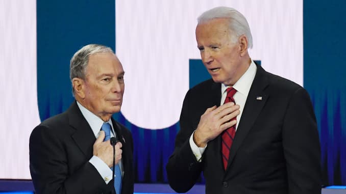 Democratic presidential hopefuls Former New York Mayor Mike Bloomberg (L) and Former Vice President Joe Biden (R) speak during a break in the ninth Democratic primary debate of the 2020 presidential campaign season co-hosted by NBC News, MSNBC, Noticias Telemundo and The Nevada Independent at the Paris Theater in Las Vegas, Nevada, on February 19, 2020.