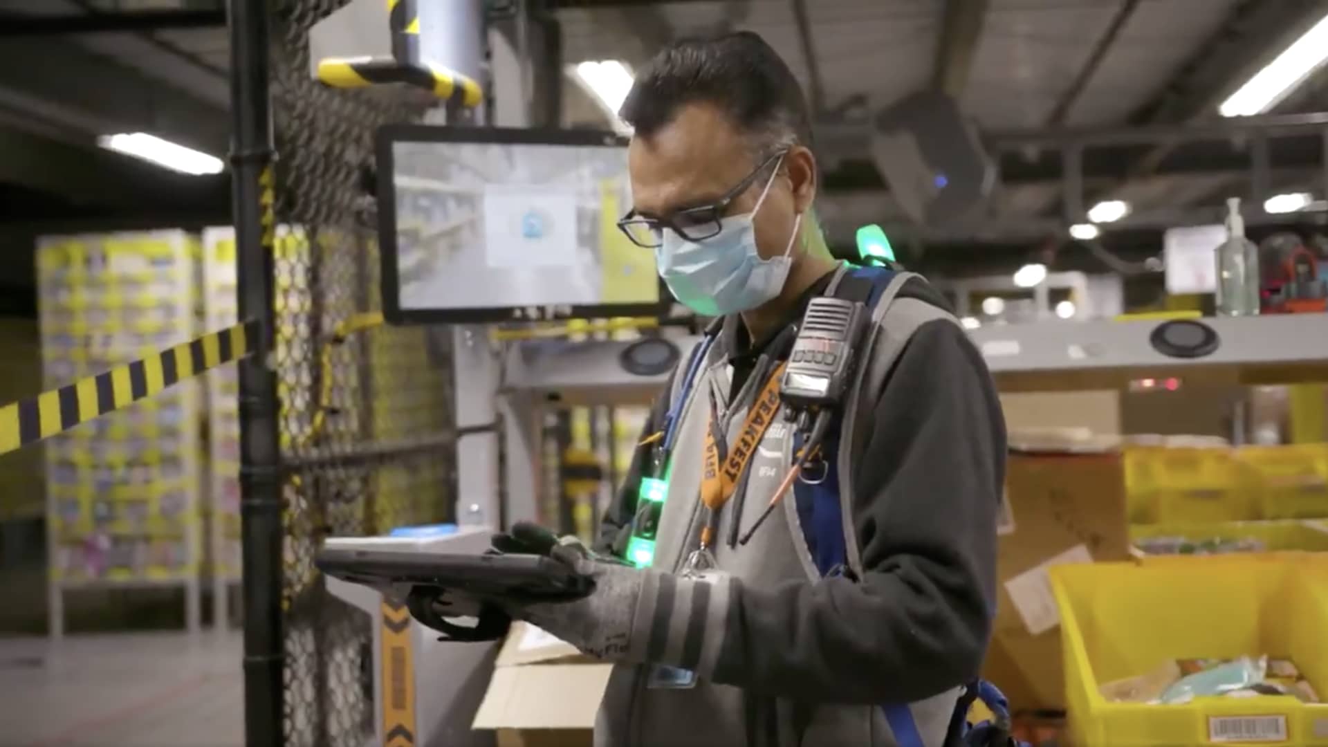 An Amazon worker inside a warehouse during coronavirus pandemic