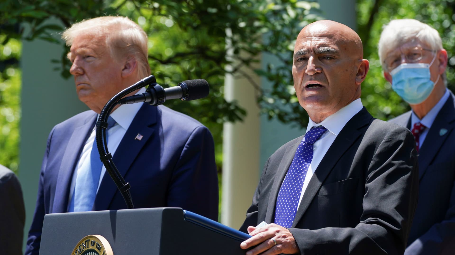 Former GlaxoSmithKline pharmaceutical executive Moncef Slaoui, who will serve as chief adviser on the effort to find a vaccine for the coronavirus disease (COVID-19) pandemic, speaks as President Donald Trump listens during a coronavirus disease response event in the Rose Garden at the White House in Washington.