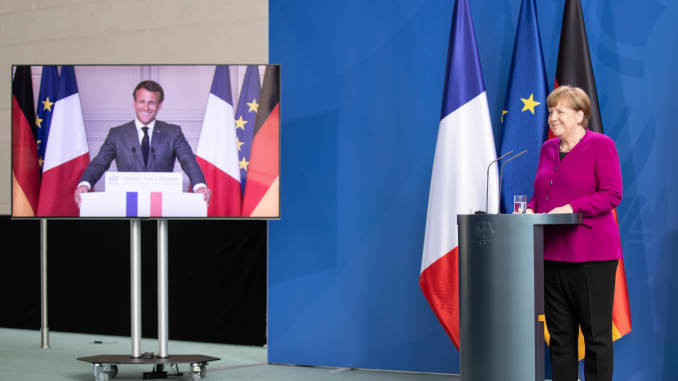 BERLIN, GERMANY - MAY 18: German Chancellor Angela Merkel and French President Emmanuel Macron, seen present live via video, speak to the media at the Chancellery during the coronavirus crisis on May 18, 2020.