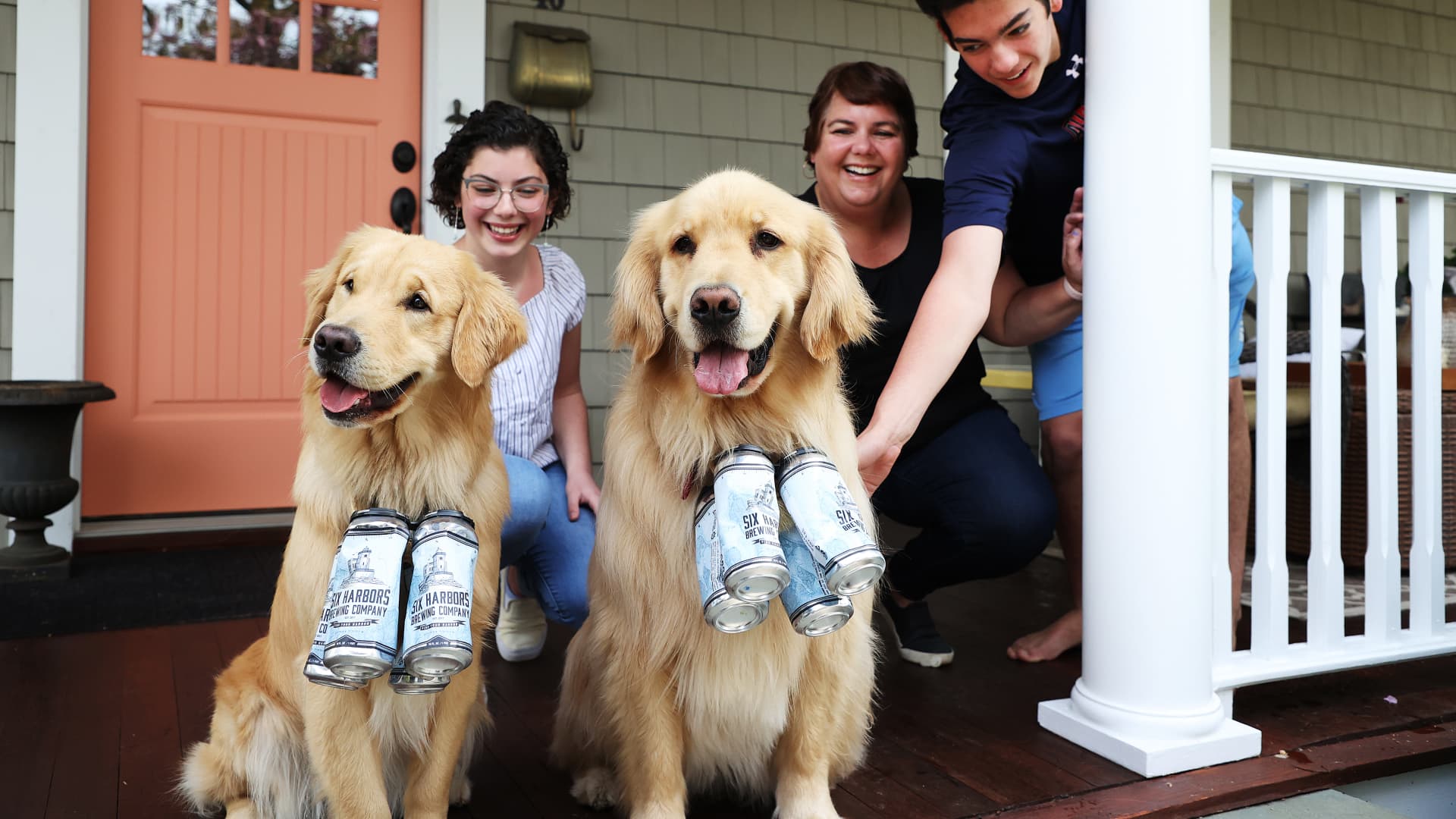 Lisa Fascilla, with children Nina and Alex receive a beer delivery. (Photo by Al Bello/Getty Images)