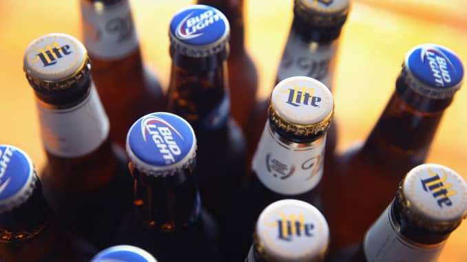 In this photo illustration, bottles of Miller Lite and Bud Light beer that are products of SABMiller and Anheuser-Busch InBev (respectively) are shown on September 15, 2014 in Chicago.