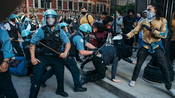 Protesters clash with police in Chicago, on May 30, 2020 during a protest against the death of George Floyd, an unarmed black man who died while while being arrested and pinned to the ground by the knee of a Minneapolis police officer.
