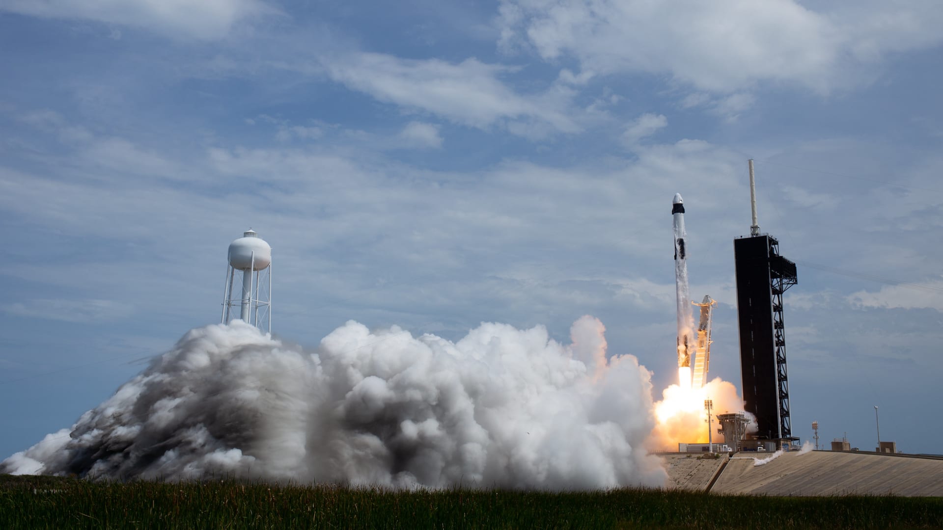 A SpaceX Falcon 9 rocket carrying the company's Crew Dragon spacecraft is launched on the Demo-2 mission with NASA astronauts Robert Behnken and Douglas Hurley onboard.
