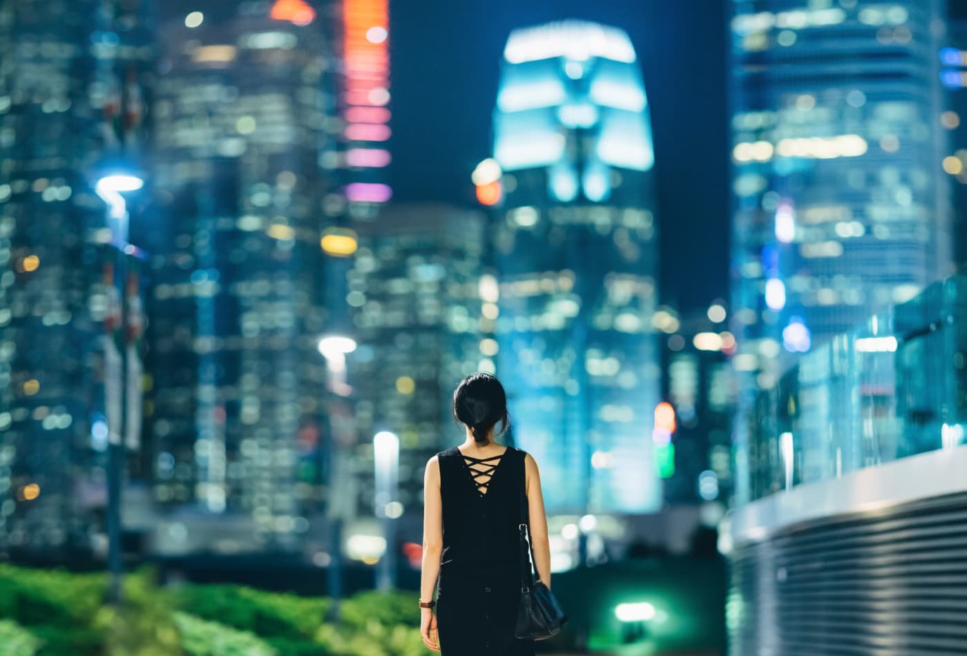 Rear view of woman looking towards downtown area of Hong Kong