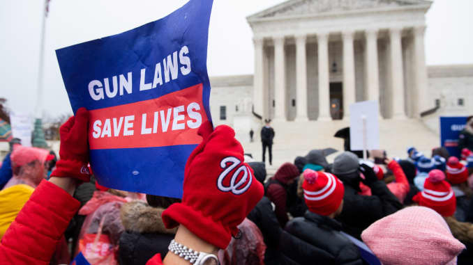 Supporters of gun control and firearm safety measures hold a protest rally outside the US Supreme Court as the Court hears oral arguments in State Rifle and Pistol v. City of New York, NY, in Washington, DC, December 2, 2019.