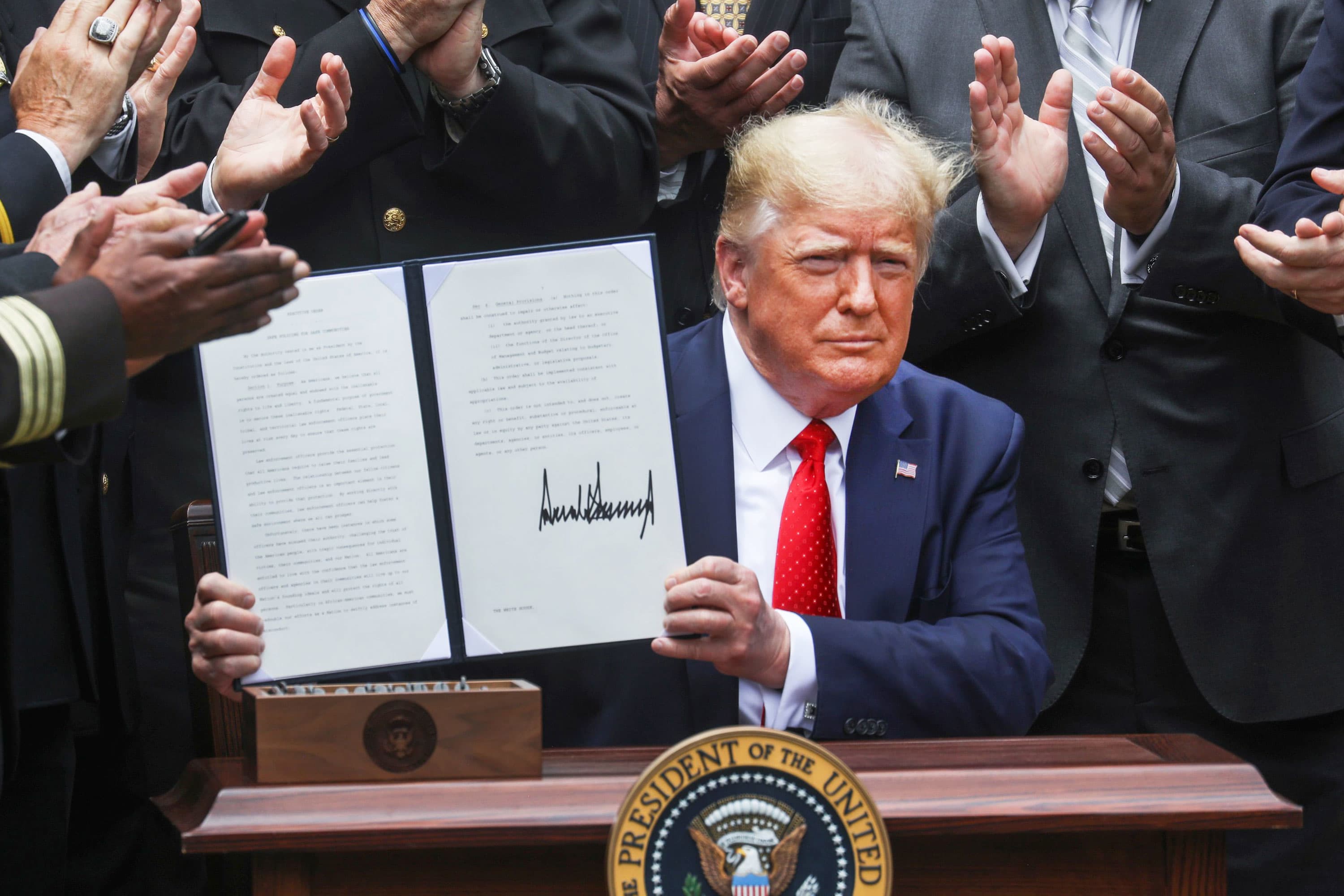 Trump signs executive order urging police reform, says cops need more funding