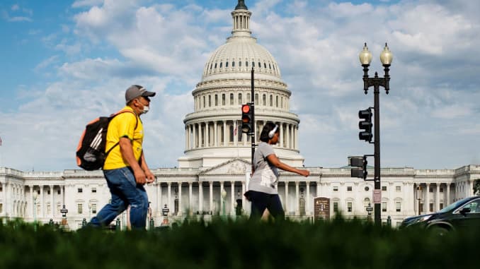 A man walks past the U.S. Capitol building in Washington, June 25, 2020.