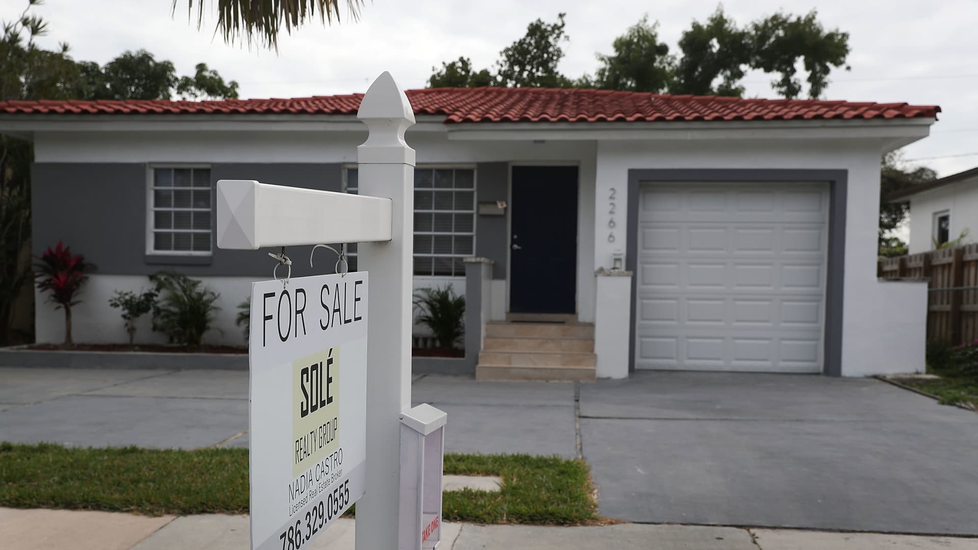 A for sale sign is seen in front of a home as the National Association of Realtors released a report showing that home sales dropped in December of 2017 on January 24, 2018 in Miami, Florida.