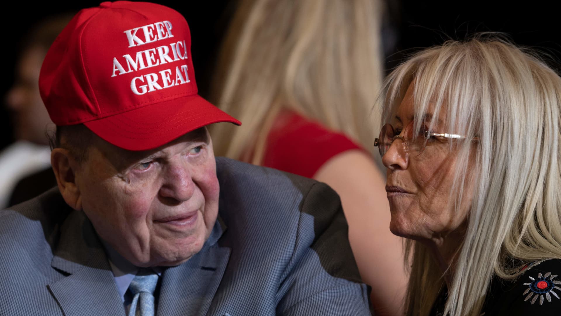 CEO and chairman of casino company Las Vegas Sands Sheldon Adelson (L) listens as US President Donald Trump delivers remarks at a Keep America Great rally in Las Vegas, Nevada, on February 21, 2020.