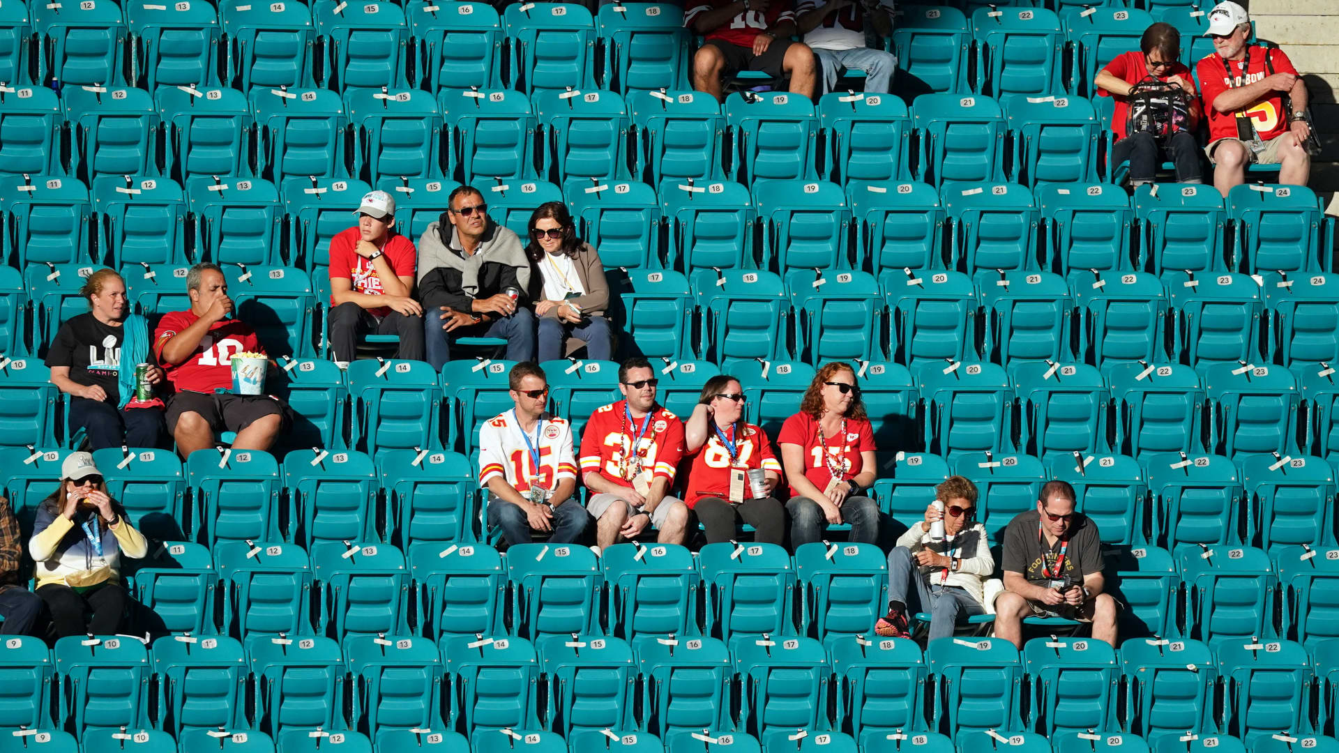 San Francisco 49ers and Kansas City Chiefs fans look on in game action during the Super Bowl LIV game between the Kansas City Chiefs and the San Francisco 49ers on February 2, 2020 at Hard Rock Stadium, in Miami Gardens, FL.