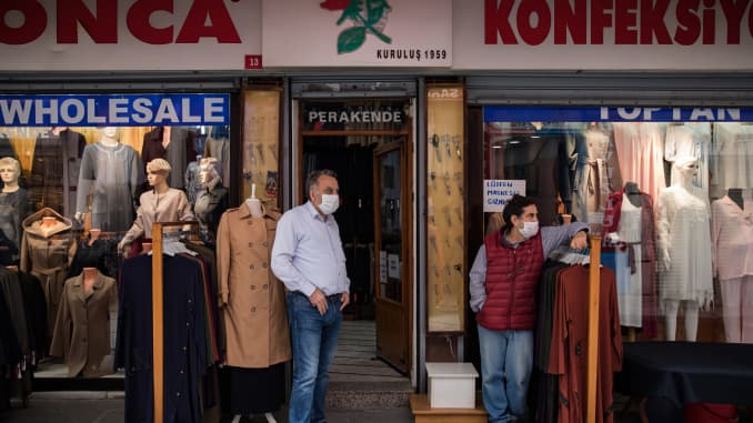 Shop owners wait for customers outside of their retail stores in the Mercan district of Istanbul, Turkey, on Thursday, May 14, 2020.