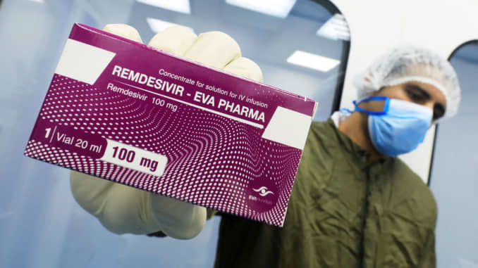 A lab technicians shows the coronavirus disease (COVID-19) treatment drug "Remdesivir".